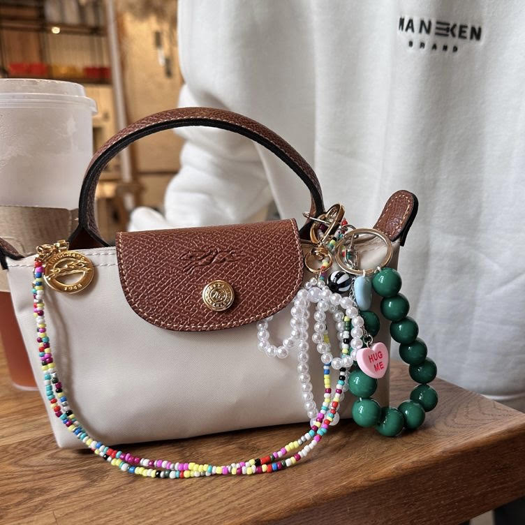 2025 micro trends, wearable trends, spring 2025 wearable fashion trends
, bag charms, shoe charms, bag charm 