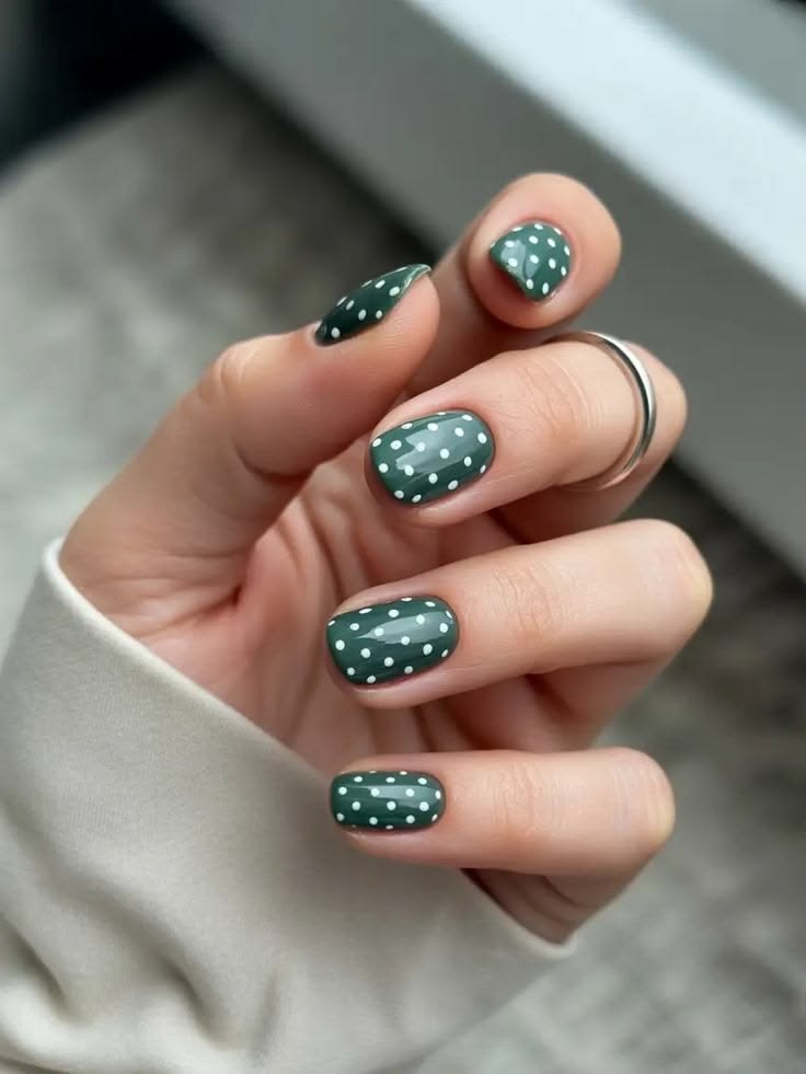 green polka dots nail design
